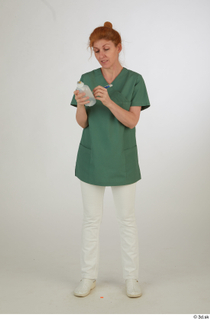 Photos Daya Jones Nurse in green Pose 2 preparing medication…